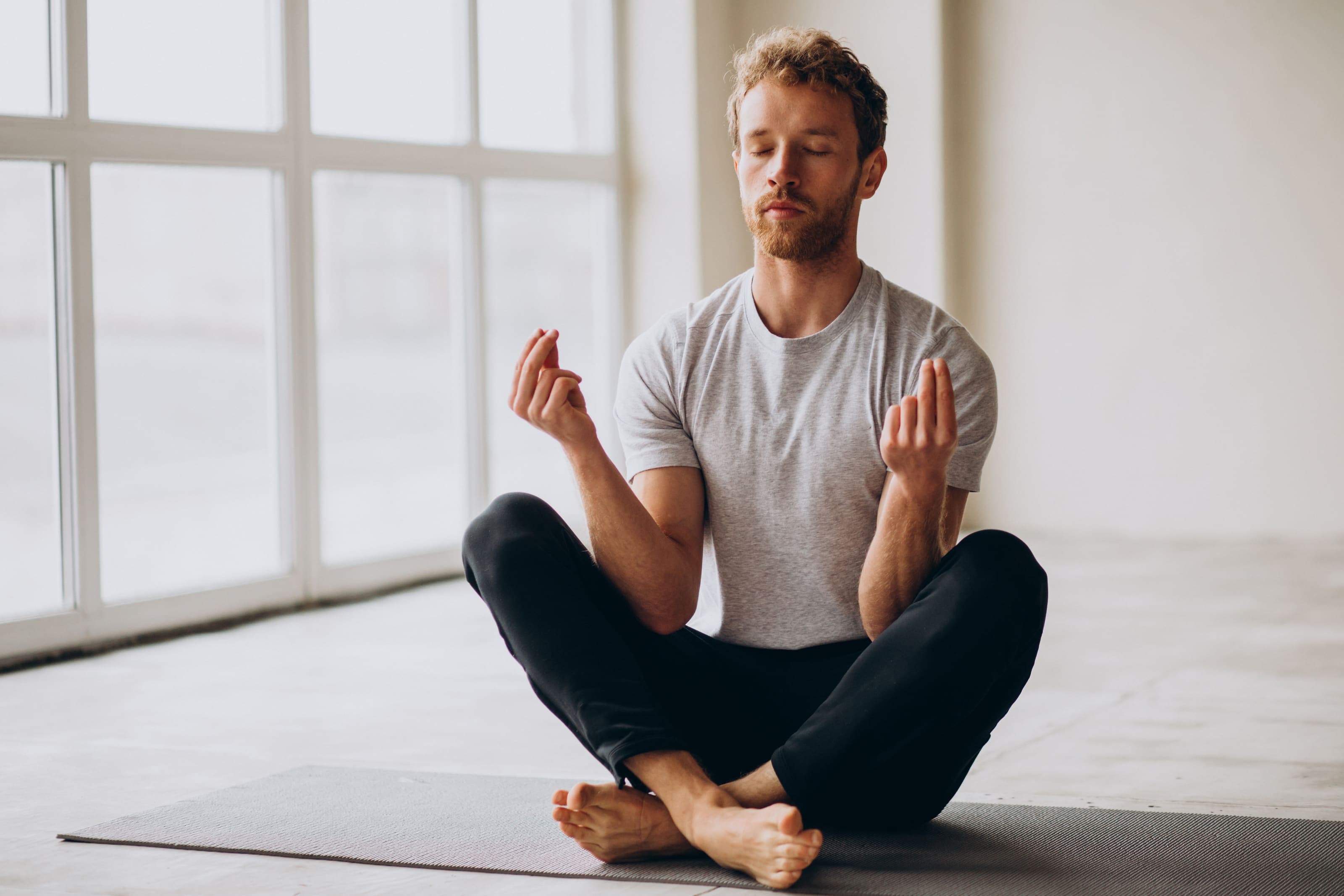 Man practicing yoga at home